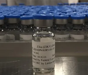 a bottle of alcohol sitting on a conveyor belt