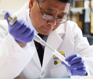 A scientist in a lab coat conducting experiments in a laboratory